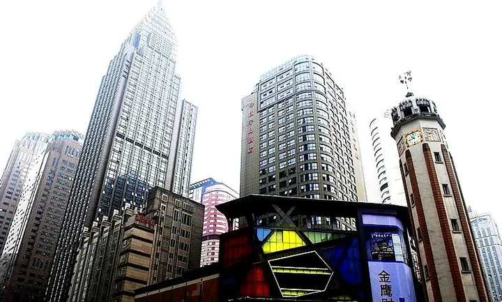 Jiefangbei, dwarfed by the towers that surround it