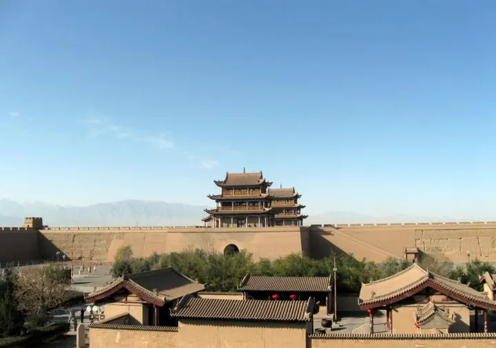 Jiayuguan's gate tower rising above the rammed-earth wall