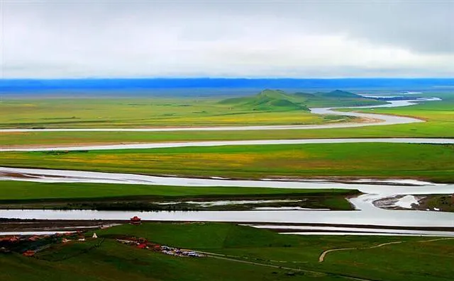 The braided upper Yellow River, split by grassland into several channels — lake-wide in places, a step across in others