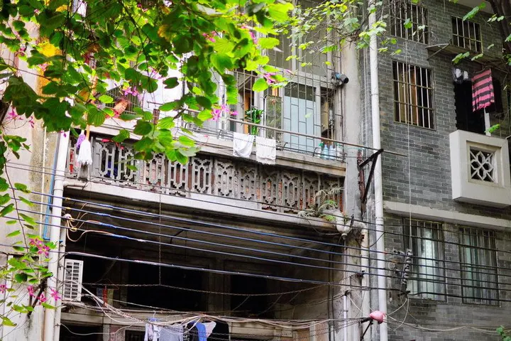 Laundry and flowers on an old-town balcony