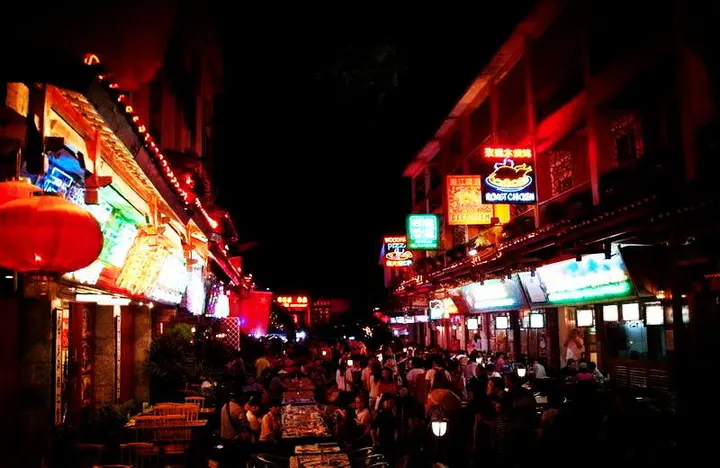 West Street after dark, lanterns all the way to the river