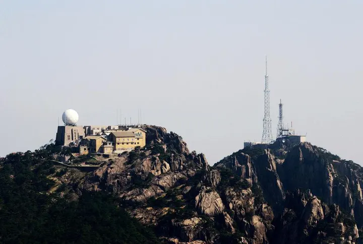 The weather station on Bright Summit: white radome and lattice tower, the highest observation point in eastern China