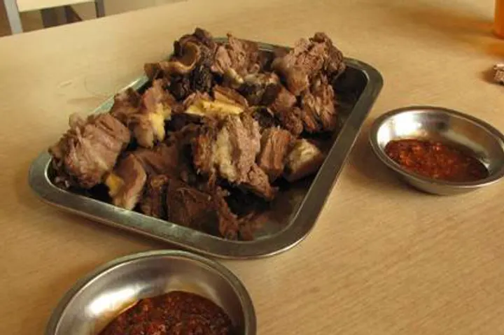 Hand-grabbed lamb, bone-in and barely seasoned, with chilli-salt on the side