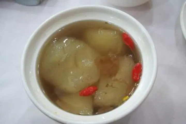 Hot winter pear, stewed in rock-sugar syrup with a few goji berries