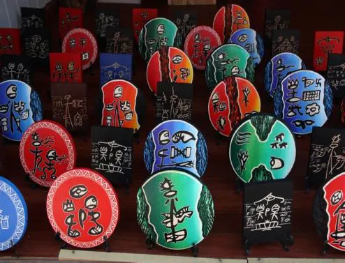 Painted hand drums hanging for sale