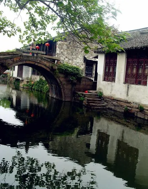 A stone bridge and riverside houses in a Jiangnan water town