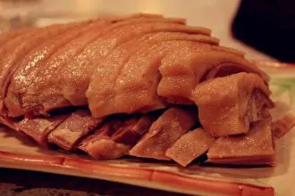 Salted duck, chopped to order: white skin, pink flesh