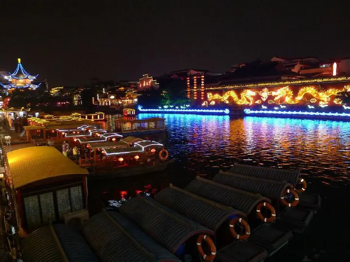 A painted boat on the Qinhuai River after dark