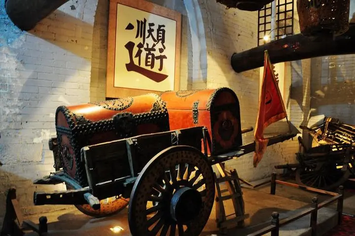 The armoured escort cart in the biaoju museum, flag still mounted