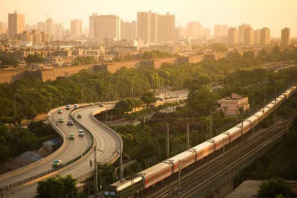 Xi'an at dusk, with a metro train sweeping through the foreground