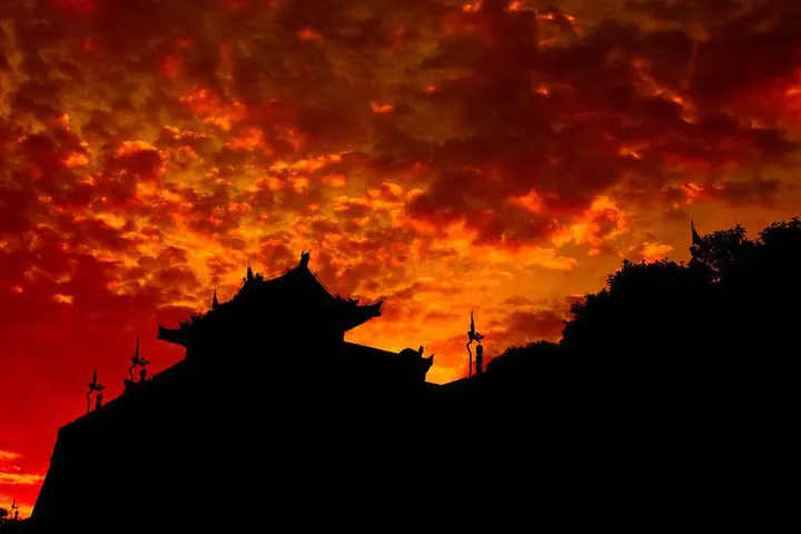 The South Gate tower against a burning sunset