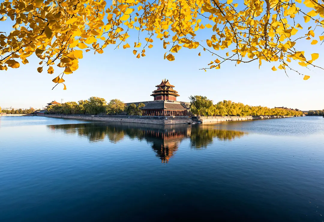 The Forbidden City with the Treasure Gallery — The corner tower and moat in autumn