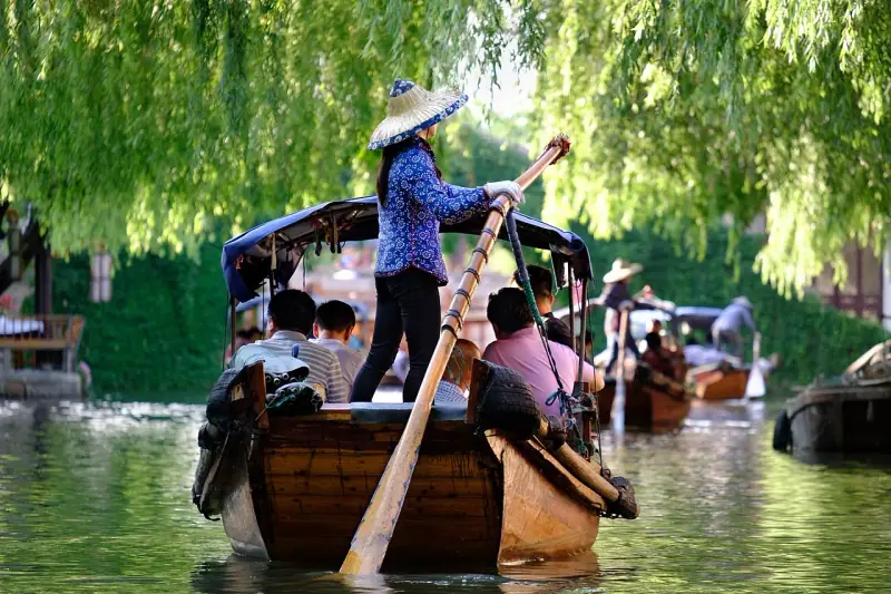 Sculling boats under the willows