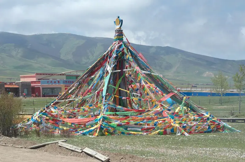 A prayer-flag cairn on the pass